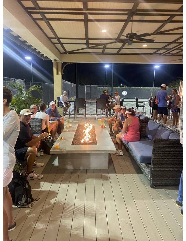 Members gathering around the BLVD fire pit